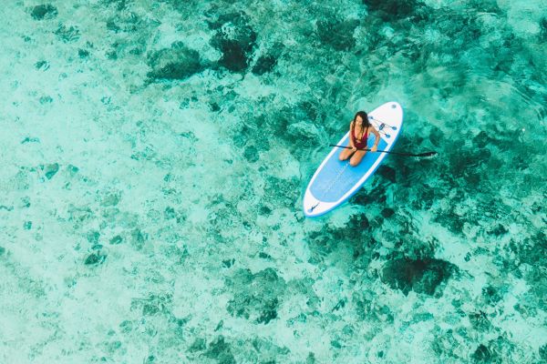 Paddleboarding at sunrise from a seaside villa in St. Barths