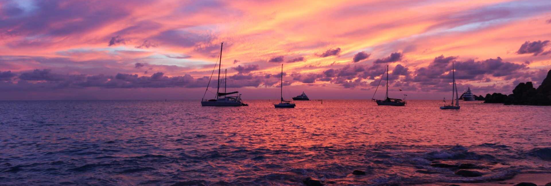 A blazing horizon at sunset from an idyllic beach on St. Barts